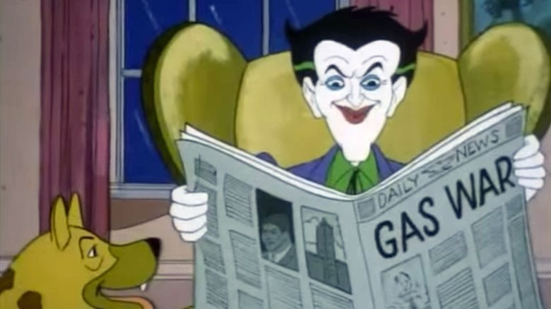 the joker reads newspaper