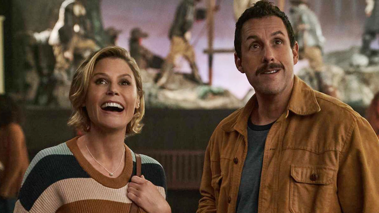 Adam Sandler smiles with Julie Bowen