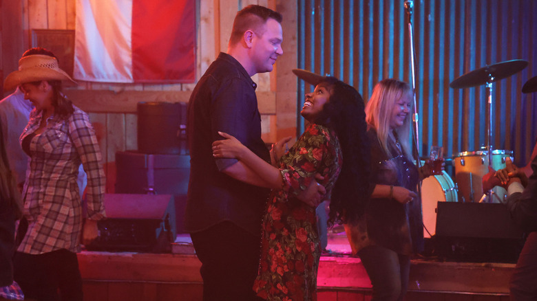 Judd and Grace dancing in a bar