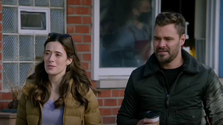 Ruzek and Burgess holding coffee