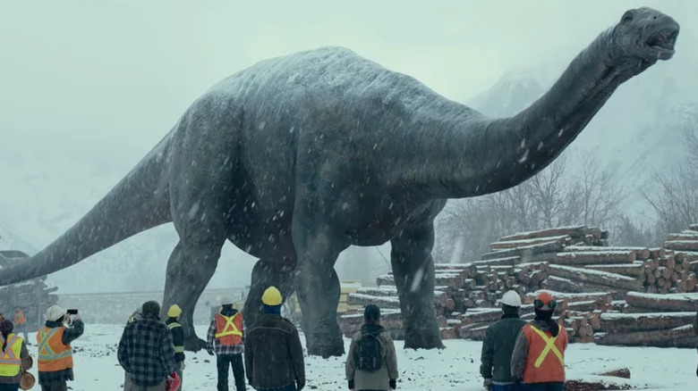 Apatosaurus walking in the snow