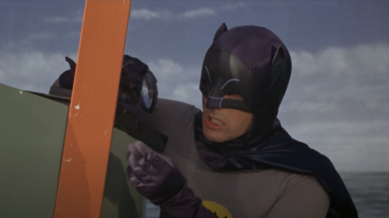 Adam West with magnifying glass