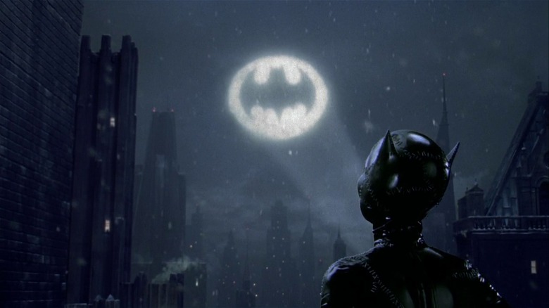 Catwoman looks at Batsignal 