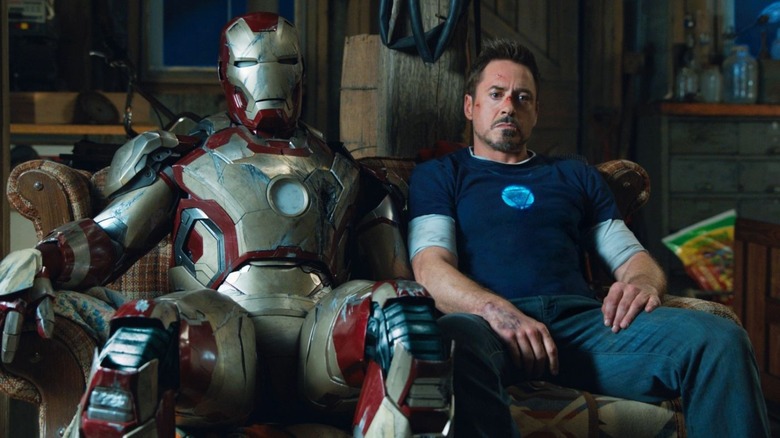 Robert Downey Jr. chilling with an Iron Man suit