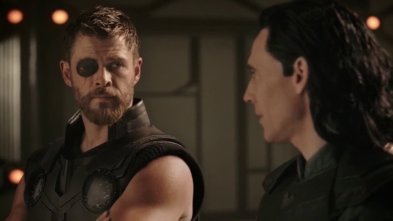 Chris Hemsworth having a chat with Tom Hiddleston