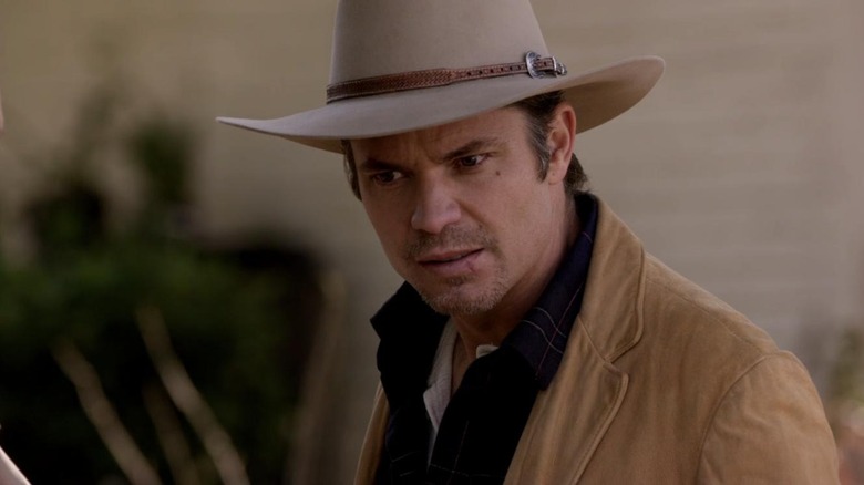 Raylan sneers