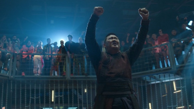 Benedict Wong raising his fists