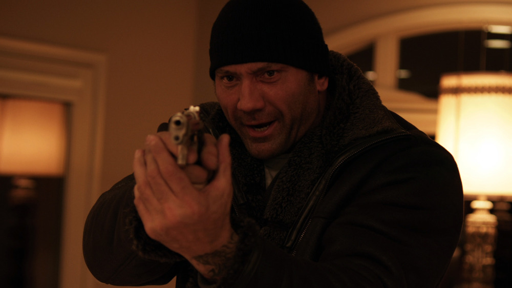 Dave Bautista holding gun