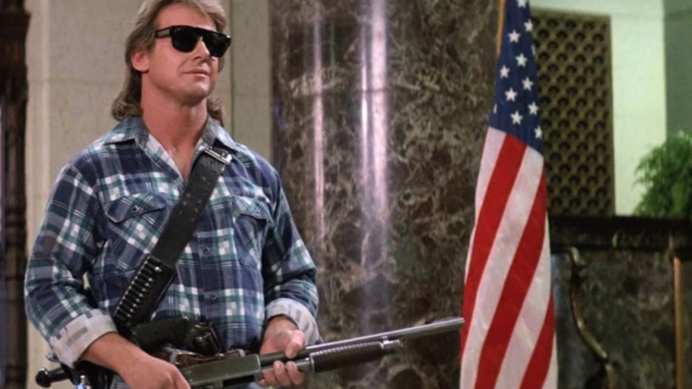 Roddy Piper holding shotgun