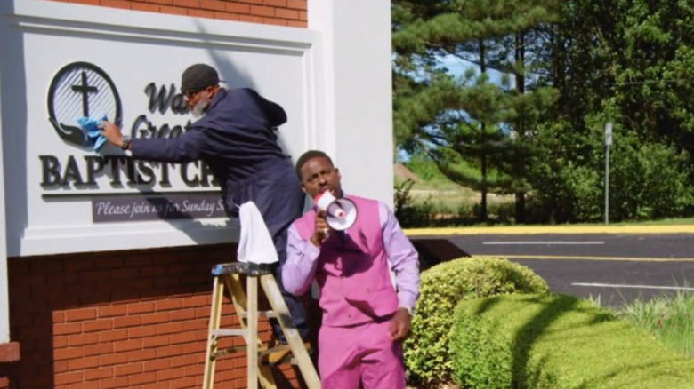 Lee-Curtis Childs talking into megaphone