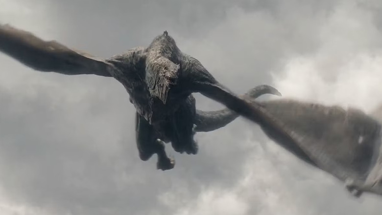 Aemond flying Vhagar through a cloudy sky in House of the Dragon (2022)