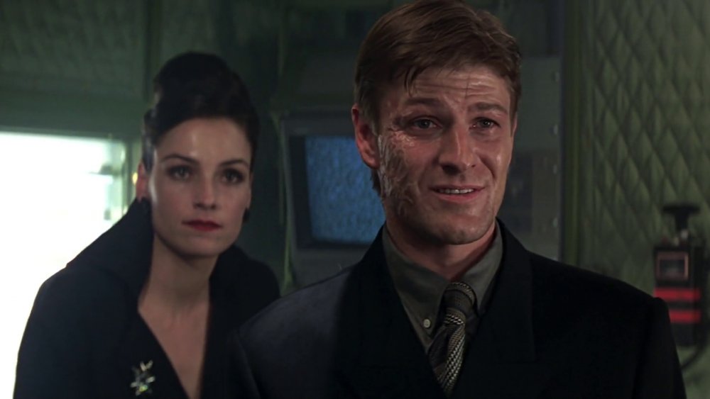 The scarred Alec Trevelyan, flanked by assassin Xenia Onatopp