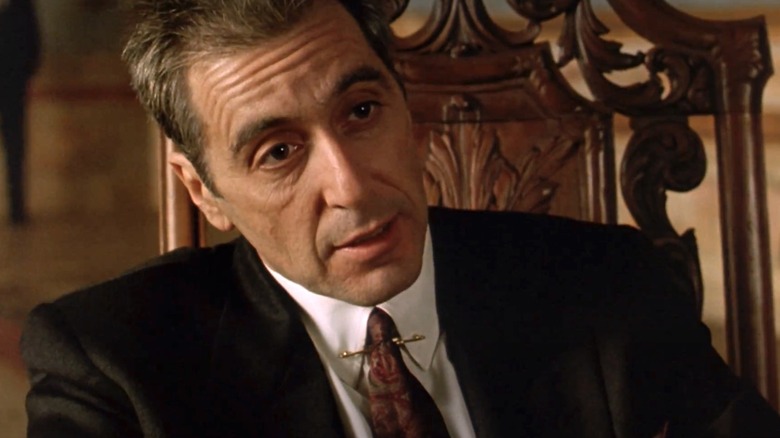 Al Pacino sitting in chair