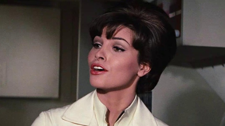 Raquel Welch talking as Cora