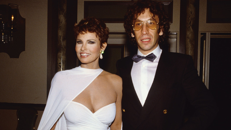 Raquel Welch standing with husband André Weinfeld in 1982