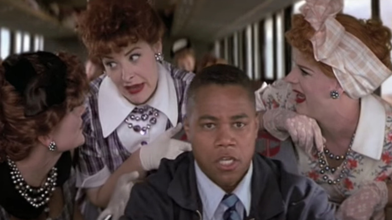 Cuban Gooding Jr. driving surrounded by women 