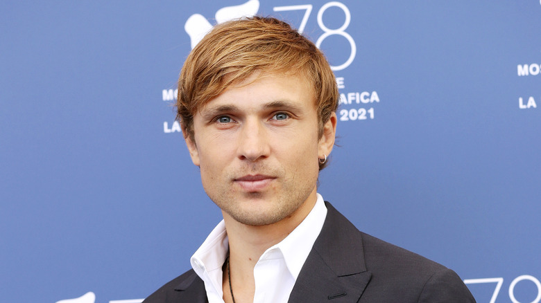 William Moseley suit with blue background