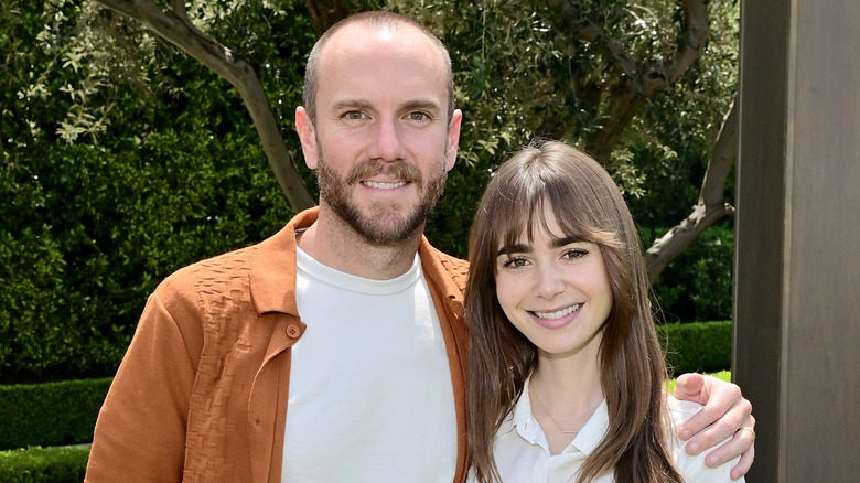 Charlie McDowell and Lily Collins smiling