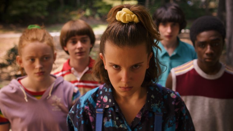 The kids watch with Eleven glaring