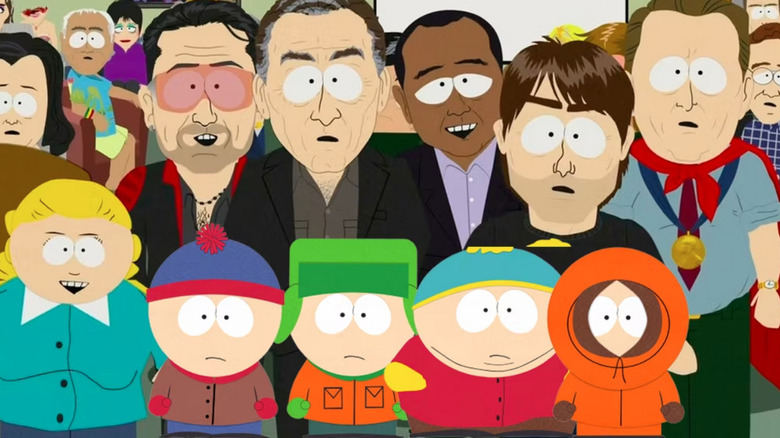 Celebrities stand behind the South Park kids