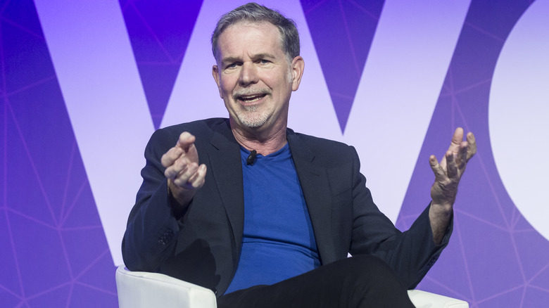 Reed Hastings sitting in a chair