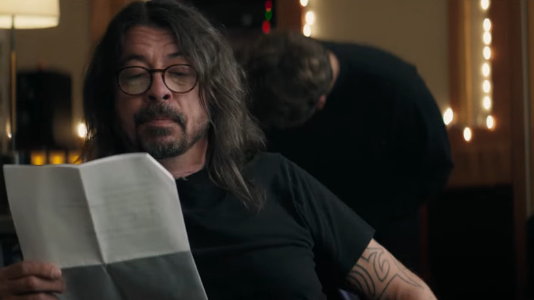 Dave Grohl reading a piece of paper for Crown Royal