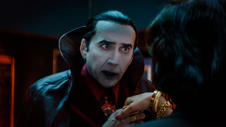 Count Dracula kissing woman's hand