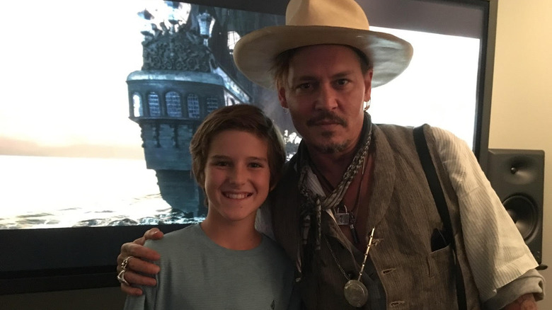 Barton smiling next to Johnny Depp