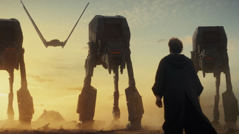 Luke standing in front of AT-AT walkers