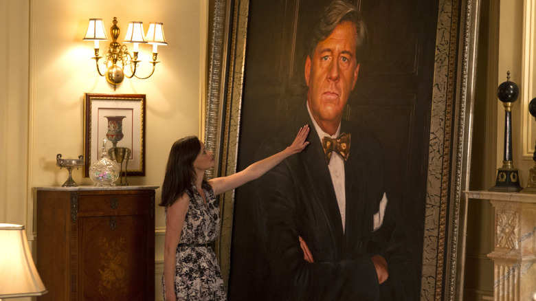 Rory places her hand on a painting of Richard