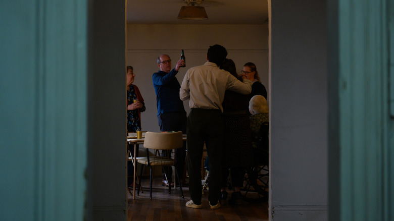 The Blakes through a doorway