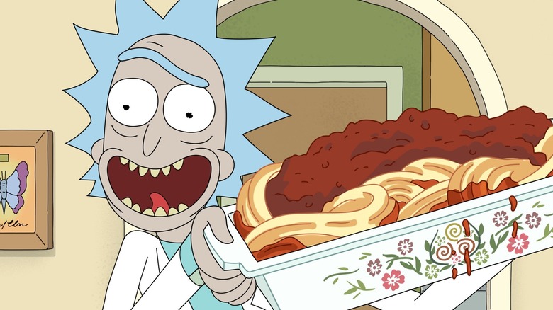 Rick holding plate of spaghetti