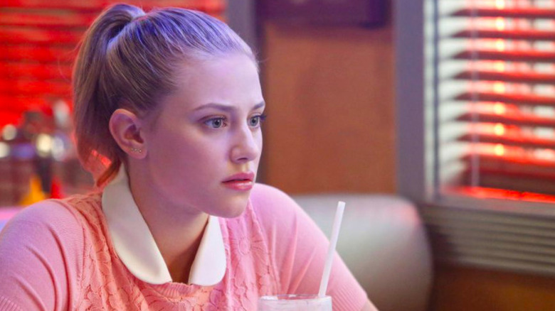 Betty Cooper sitting at Pop's