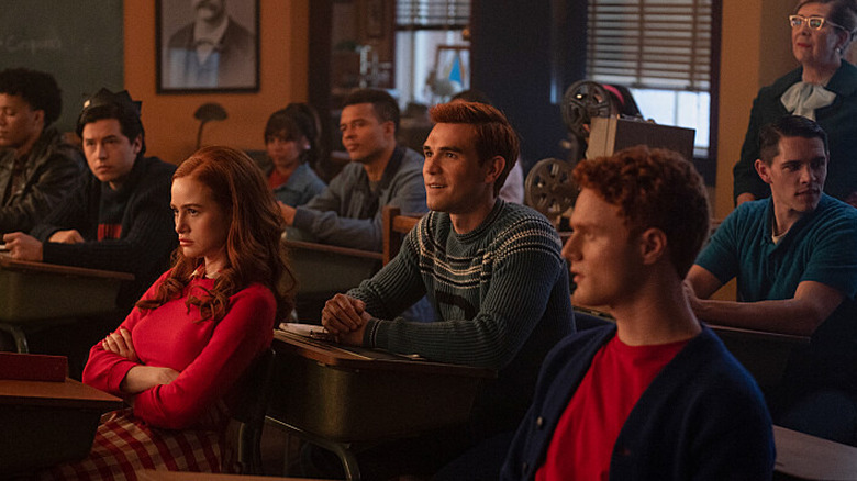 Cheryl Blossom, Archie Andrews, and Julian Blossom sitting in class