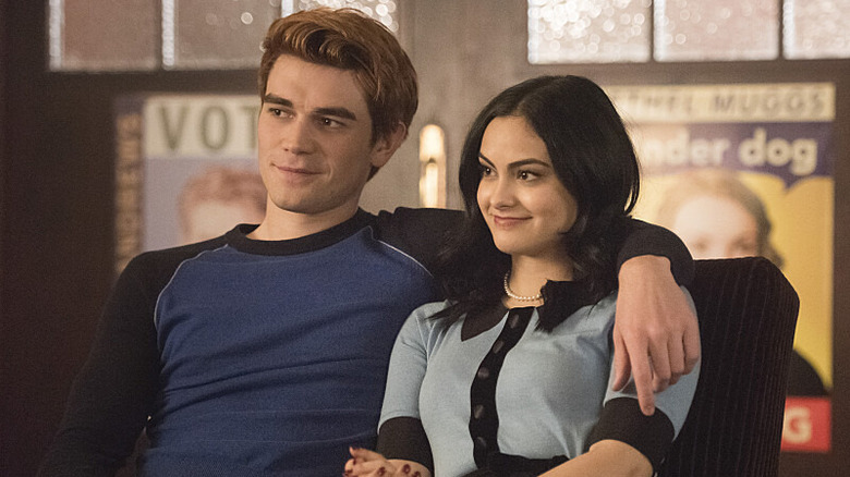 Archie with arm around Veronica