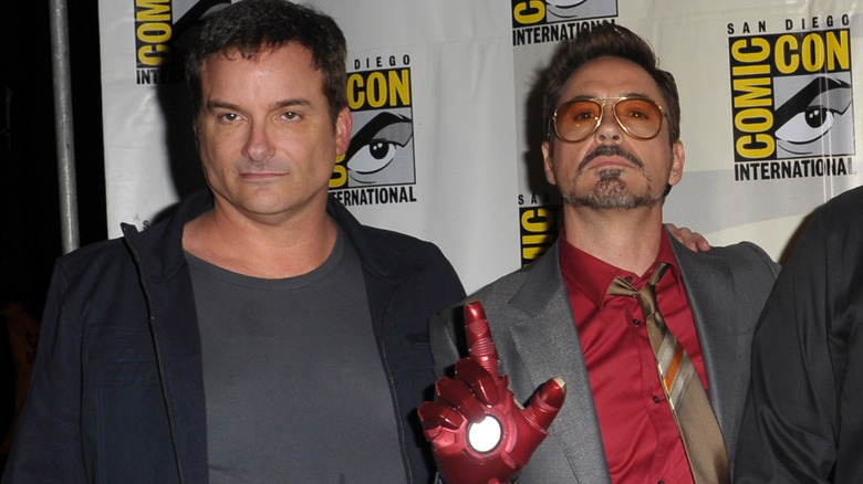 Shane Black and Robert Downey, Jr. with Iron Man glove