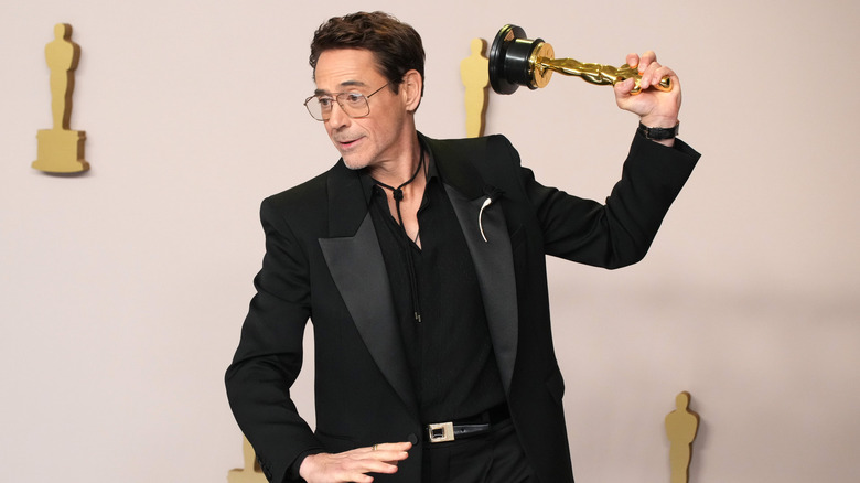 Robert Downey Jr. holding Academy Award