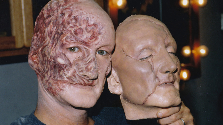 Robert Englund in Freddy makeup holding head double