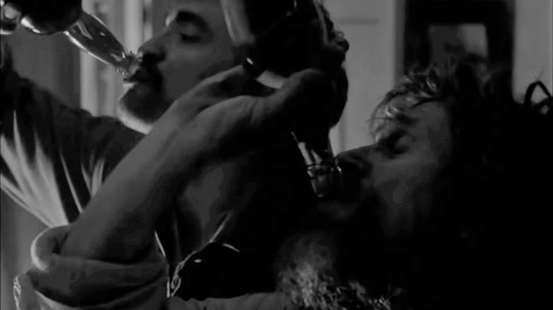 Pattinson and Dafoe drinking