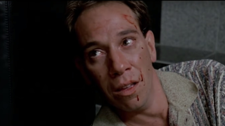 Miguel Ferrer with blood on face