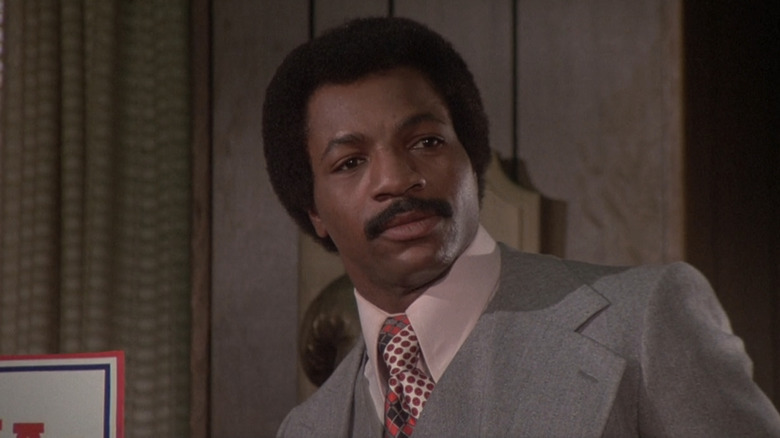 Apollo Creed wearing a suit