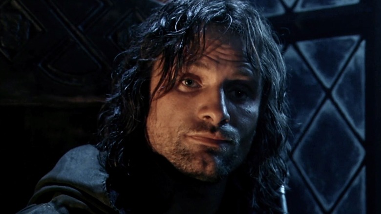 Aragorn looks at the hobbits