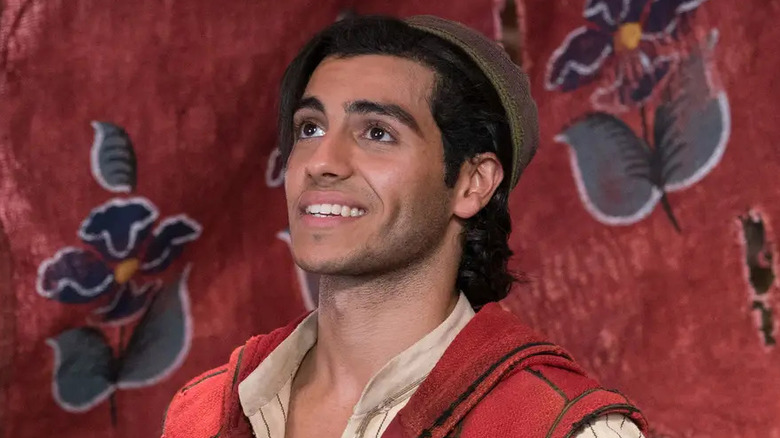 Aladdin looking up, smiling