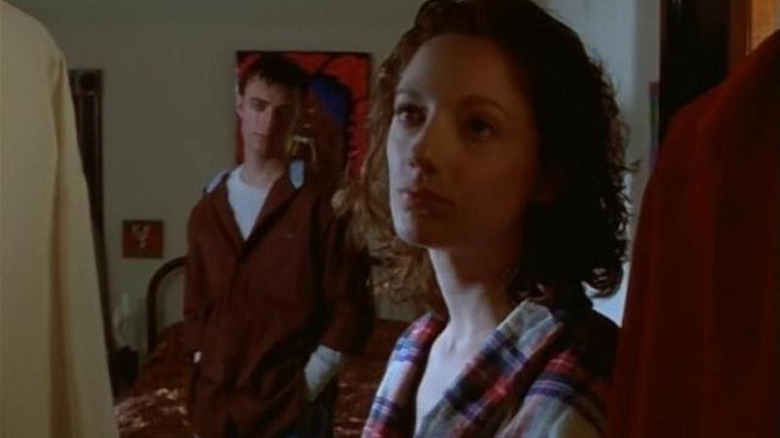 Judy Greer looks in a closet