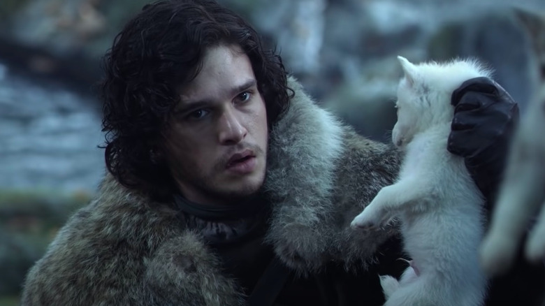 Kit Harington holding dire wolf