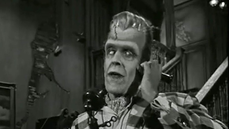 Fred Gwynne as Herman Munster answering the phone