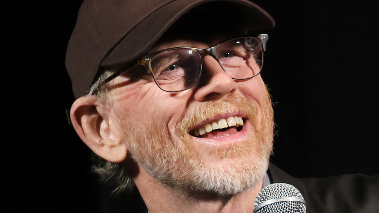 Ron Howard holding a microphone