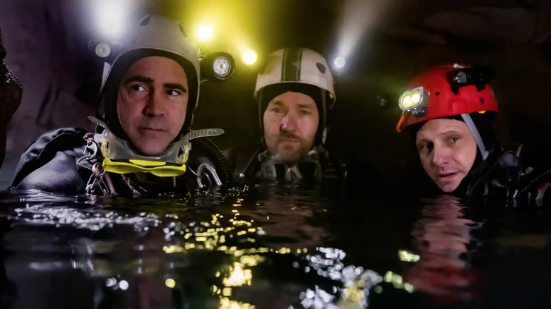 cave divers in water