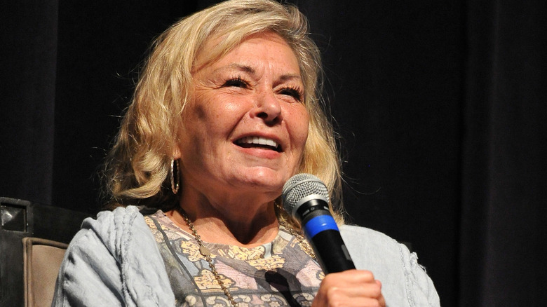 Roseanne Barr holding microphone