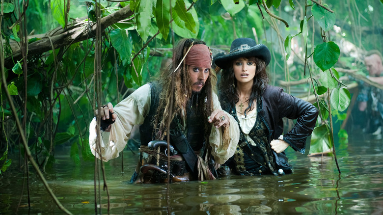 Depp and Cruz traveling through a swamp